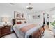 Inviting bedroom with wood floors, area rug, ceiling fan, and a walk in closet at 403 Defoors Mill Nw Dr, Atlanta, GA 30318