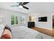 Cozy bedroom with shuttered windows and hardwood flooring at 403 Defoors Mill Nw Dr, Atlanta, GA 30318