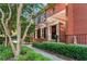 Charming brick home with a manicured front yard and a black front door with a wreath at 403 Defoors Mill Nw Dr, Atlanta, GA 30318
