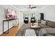 Bright and airy living room featuring hardwood floors and stylish gray furniture at 403 Defoors Mill Nw Dr, Atlanta, GA 30318