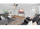 Comfortable living room with stylish decor and a view into the dining area at 403 Defoors Mill Nw Dr, Atlanta, GA 30318