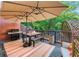 Outdoor patio with BBQ, dining table, seating and umbrella for relaxing or entertaining at 403 Defoors Mill Nw Dr, Atlanta, GA 30318