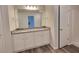 Bathroom featuring granite counters, dual sinks, modern fixtures, and bright lighting at 80 Heyman Dr, Covington, GA 30016