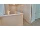 Upstairs hallway featuring white trim, neutral carpet, and ample closet space at 80 Heyman Dr, Covington, GA 30016