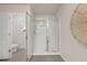 Clean bathroom featuring a glass shower enclosure, neutral walls, and modern fixtures at 1019 Merritt Dr # 102, Villa Rica, GA 30180