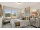 Charming bedroom with two large windows, mirrored nightstand, and decorative gold accents at 1019 Merritt Dr # 102, Villa Rica, GA 30180