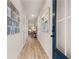 Inviting entryway featuring beautiful wood floors, modern decor, and a view into the living area at 1019 Merritt Dr # 102, Villa Rica, GA 30180