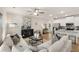 Bright living room featuring neutral decor, a white sofa, wood floors and an open flow into kitchen area at 1019 Merritt Dr # 102, Villa Rica, GA 30180