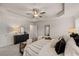Relaxing main bedroom featuring a tray ceiling, neutral decor, and an elegant upholstered bench at 1019 Merritt Dr # 102, Villa Rica, GA 30180