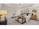 A serene main bedroom with a tray ceiling, neutral tones, and well-coordinated furniture and decor at 1019 Merritt Dr # 102, Villa Rica, GA 30180