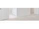 Bright hallway featuring neutral carpet with an open doorway and white trim at 141 Bennett Farm Dr, Loganville, GA 30052