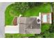 Aerial view of a home with a backyard pool, a patio with furniture, a well-maintained lawn, and lush landscaping at 1491 Black Hickory Pl, Norcross, GA 30093