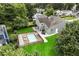 An inviting backyard with a refreshing pool, an outdoor seating area, and lush green grass at 1491 Black Hickory Pl, Norcross, GA 30093
