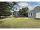 A large backyard with plenty of space, grass, fenced-in pool, and access to the home at 1491 Black Hickory Pl, Norcross, GA 30093