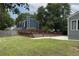 The fenced-in backyard has an in-ground pool and grassy area; it's ideal for outdoor activities at 1491 Black Hickory Pl, Norcross, GA 30093