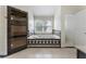 Elegant bathroom features a soaking tub, a glass-enclosed shower, and neutral tile flooring at 1491 Black Hickory Pl, Norcross, GA 30093