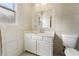 Bathroom featuring tiled walls and floors, a vanity with a sink, and a toilet at 1491 Black Hickory Pl, Norcross, GA 30093