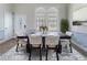 Elegant dining room with a wooden table, seating for six, and stylish decor at 1491 Black Hickory Pl, Norcross, GA 30093