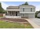 Charming two-story home featuring a landscaped front yard and a welcoming front porch at 1491 Black Hickory Pl, Norcross, GA 30093
