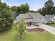 Charming home with a landscaped front yard, a covered porch, and an attached garage at 1491 Black Hickory Pl, Norcross, GA 30093