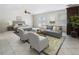 Spacious living room with a sitting area with chairs and couch, and a bedroom with a bed at 1491 Black Hickory Pl, Norcross, GA 30093