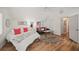 Bright bedroom with vaulted ceilings, hardwood floors, and stylish decor at 230 Bristol Stone Ct, Johns Creek, GA 30005