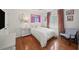 Cozy bedroom with hardwood floors, white furnishings, and modern decor at 230 Bristol Stone Ct, Johns Creek, GA 30005