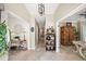 Spacious hallway with tile flooring, decorative accents, and ample lighting at 230 Bristol Stone Ct, Johns Creek, GA 30005