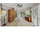 Bright home office with shuttered windows, neutral walls, and built-in storage at 230 Bristol Stone Ct, Johns Creek, GA 30005
