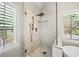Elegant glass shower with gold fixtures and white marble tiling at 230 Bristol Stone Ct, Johns Creek, GA 30005