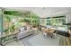 A spacious sunroom with lots of natural light that offers a seamless transition to the outdoors at 230 Bristol Stone Ct, Johns Creek, GA 30005