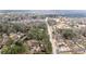 Aerial view showcases a residential area with tree-lined streets and well-maintained homes at 3032 Ross Rd, Snellville, GA 30039