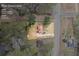 Overhead view of the property with clearly marked lot lines, surrounded by lush greenery at 3032 Ross Rd, Snellville, GA 30039