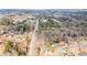 Aerial view showcases a residential area with tree-lined streets and well-maintained homes at 3032 Ross Rd, Snellville, GA 30039
