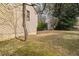 View of the backyard with mature trees and grass at 3032 Ross Rd, Snellville, GA 30039