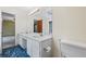 Bathroom with a large vanity, double sinks, a toilet, and blue tiled floor at 3032 Ross Rd, Snellville, GA 30039