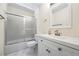 Bright bathroom features a shower with glass doors, white vanity, and contemporary fixtures at 3032 Ross Rd, Snellville, GA 30039