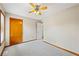 This carpeted bedroom features a ceiling fan, a closet, and an exterior window view at 3032 Ross Rd, Snellville, GA 30039