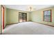 Spacious bedroom with large windows, a sliding door to the deck, and neutral carpet at 3032 Ross Rd, Snellville, GA 30039