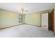 This bright bedroom features a ceiling fan, carpet, closet, and exterior window at 3032 Ross Rd, Snellville, GA 30039