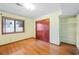 This bedroom has hardwood floors, closet, and a large window at 3032 Ross Rd, Snellville, GA 30039