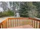 Wooden deck overlooking the backyard with an enclosed chicken coop at 3032 Ross Rd, Snellville, GA 30039