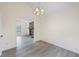 Bright dining area featuring a fireplace, modern floors and a stylish chandelier creating an inviting ambiance at 3032 Ross Rd, Snellville, GA 30039