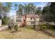 Attractive two-story home with a classic design, complemented by a well-groomed front yard and landscaping at 3032 Ross Rd, Snellville, GA 30039