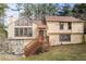 Charming two-story home with a cozy front porch, stone accents, and a well-maintained lawn at 3032 Ross Rd, Snellville, GA 30039