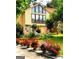 Front yard with beautiful flower beds. Two story home with architectural design at 3032 Ross Rd, Snellville, GA 30039