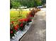 Attractive flower bed featuring vibrant red roses and white gravel at 3032 Ross Rd, Snellville, GA 30039