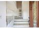 Bright foyer with light-colored steps, wood-look flooring, and clear view to open-concept living area at 3032 Ross Rd, Snellville, GA 30039