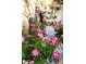 Picturesque garden adorned with flowers, a fountain, and decorative elements at 3032 Ross Rd, Snellville, GA 30039