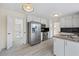 Well-designed kitchen featuring stainless steel appliances, granite counters, and ample storage space for convenience at 3032 Ross Rd, Snellville, GA 30039